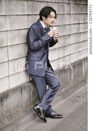 Man smoking outdoors 116764771