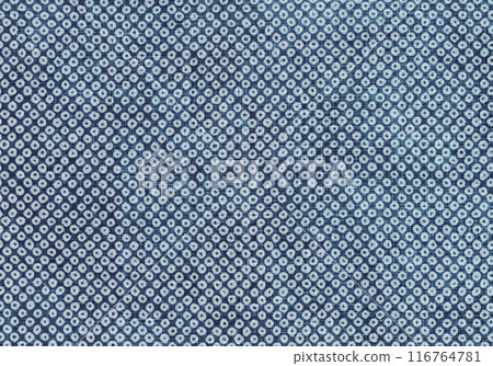 A traditional Japanese pattern dyed on indigo fabric, the bean-dyed kasuri pattern A traditional Japanese pattern dyed on indigo fabric, the bean-dyed kasuri pattern 116764781