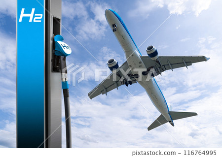 Hydrogen fuel nozzle with the inscription H2 on a background of airplane and blue sky 116764995