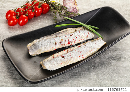 Marinated herring fillet with green onion Marinated herring fillet with green onion 116765721