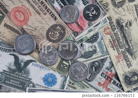 US banknotes and silver certificates with silver dollar coins 116766151