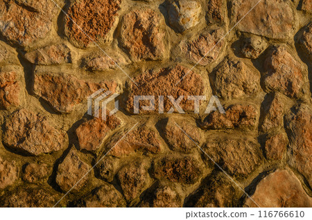 wall made of real stone as a background in the sun 9 wall made of real stone as a background in the sun 9 116766610