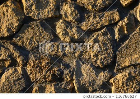 wall made of real stone as a background in the sun 1 wall made of real stone as a background in the sun 1 116766627