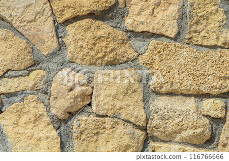 pattern decorative uneven cracked real stone wall surface with cement. with copy space image. Place for adding text or design pattern decorative uneven cracked real stone wall surface with cement. with copy space image. Place for adding text or design 116766666