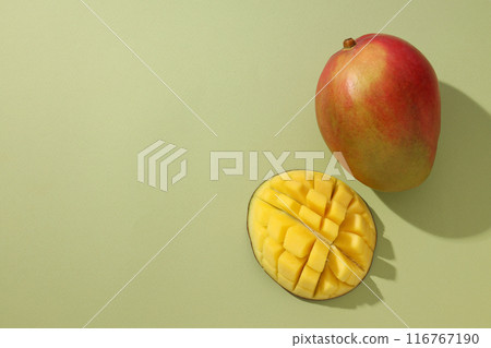 Ripe delicious mango on a light background Ripe delicious mango on a light background 116767190