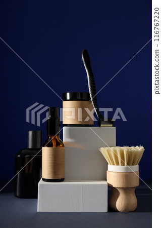 Shaving tools and bottles of men's cosmetics on dark blue background Shaving tools and bottles of men's cosmetics on dark blue background 116767220