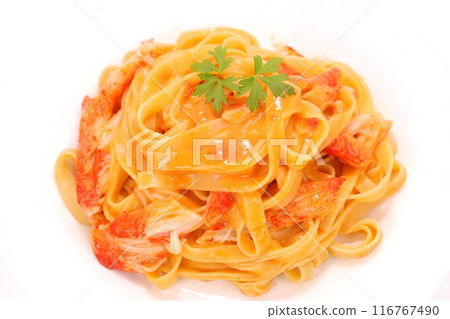 Crab-flavored tomato cream pasta with crab sticks on a light background 116767490