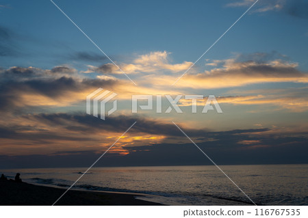 Sunset at the sea. Evening sun and path. Beautiful sky and clouds. Landscape on the coast. Ocean shore. Dawn. Nature. Waves and surf. Relaxation and culm Sunset at the sea. Evening sun and path. Beautiful sky and clouds. Landscape on the coast. Ocean shore. Dawn. Nature. Waves and surf. Relaxation and culm 116767535