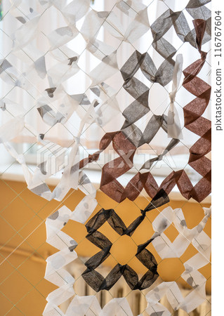 Hand woven camouflage net. Weaving winter nets from agrofibre. Hand woven camouflage net. Weaving winter nets from agrofibre. 116767604