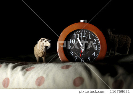 Sleep image with alarm clock and sheep Sleep image with alarm clock and sheep 116769621