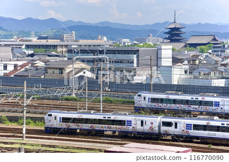 The Haruka Express train runs alongside Toji Temple in Kyoto The Haruka Express train runs alongside Toji Temple in Kyoto 116770090