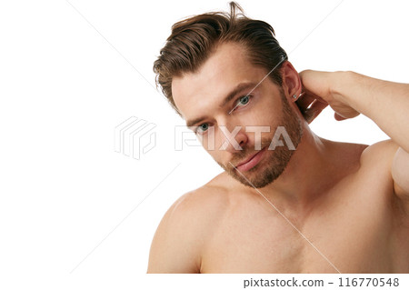 Portrait of handsome man with well-kept skin and hair, showing importance to take care after appearance isolated on white background 116770548
