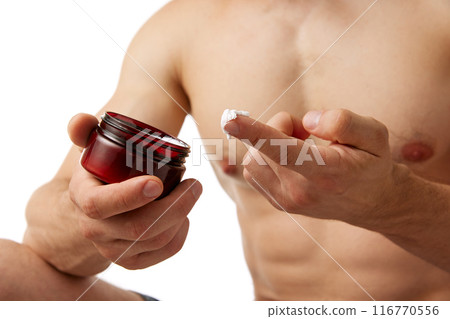 Cropped image of muscular male body, man holding bottle with moisturizing cream, taking care after skin isolated on white background 116770556