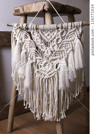 beautiful macrame panel in the interior 116771014