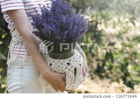 girl holding a bucket of lavender girl holding a bucket of lavender 116771049