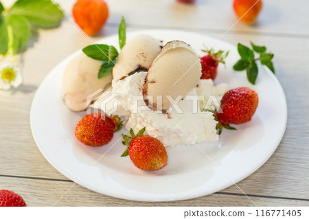 fresh organic cottage cheese with strawberries and ice cream in a plate on a wooden table fresh organic cottage cheese with strawberries and ice cream in a plate on a wooden table 116771405