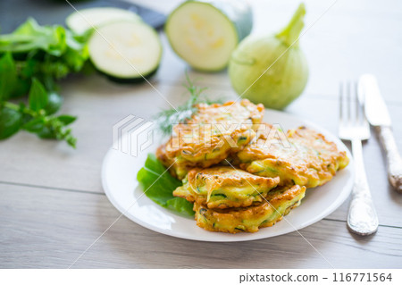 homemade food, fried zucchini pancakes 116771564