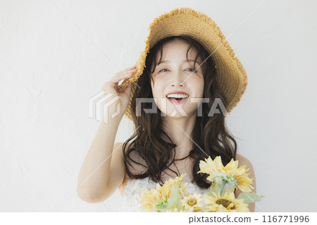 Woman in wedding dress holding sunflowers 116771996