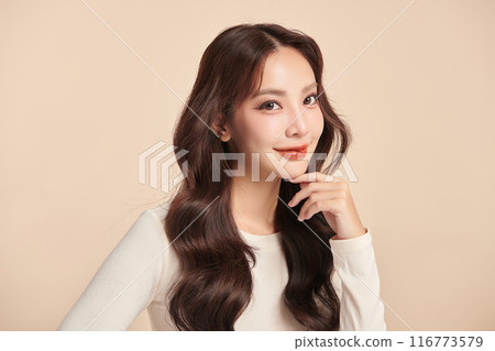 Beautiful young asian woman with clean fresh skin on beige background, Face care, Facial treatment, Cosmetology, beauty and spa, Asian women portrait. 116773579