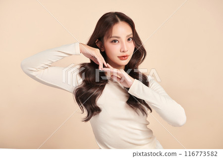Beautiful young asian woman with clean fresh skin on beige background, Face care, Facial treatment, Cosmetology, beauty and spa, Asian women portrait. 116773582