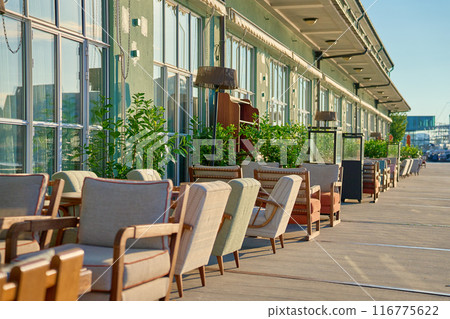 Empty outdoor cafe in morning. Terrace with tables on street 116775622