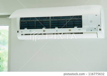 Air conditioner unit with opened front cover ready for maintenance Air conditioner unit with opened front cover ready for maintenance 116775632