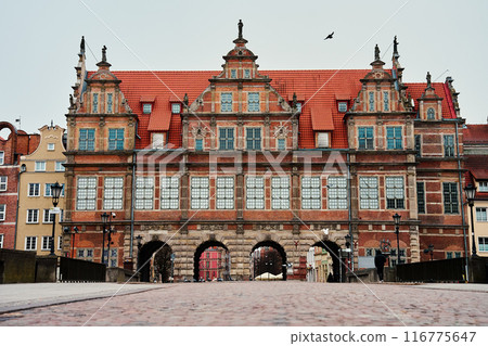 Historical building with arch. Main entrance in old town in Gdansk, Poland Historical building with arch. Main entrance in old town in Gdansk, Poland 116775647