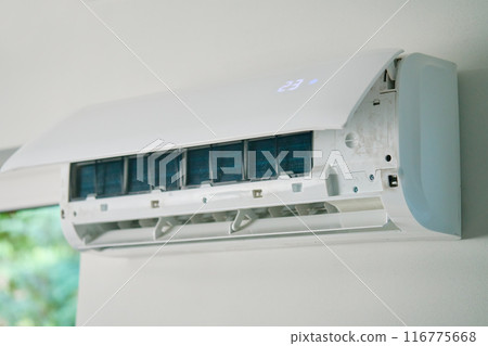 Air conditioner unit with opened front cover ready for maintenance Air conditioner unit with opened front cover ready for maintenance 116775668