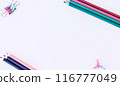 Template. White background with pencils. The image shows Free Space For Text on a white sheet. Bright picture. Concept Image 116777049