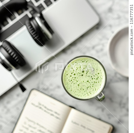 Matcha Latte and Laptop on Marble Table 116777351