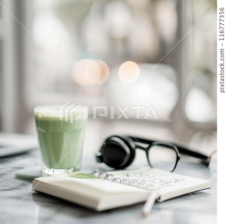 Matcha Latte and Laptop on Marble Table 116777356