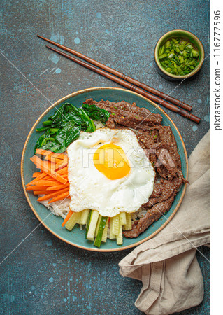 Traditional korean dish bibimbap with fried egg on top, top view 116777596