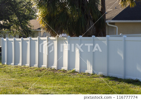 White plastic fence for back yard protection and privacy 116777774