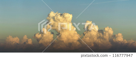 Sunset sky with bright colorful orange and yellow clouds. Panoramic skyscape 116777947