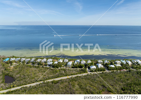 Rich neighborhood with expensive vacation homes in Boca Grande, small town on Gasparilla Island in southwest Florida. Wealthy waterfront residential area 116777990