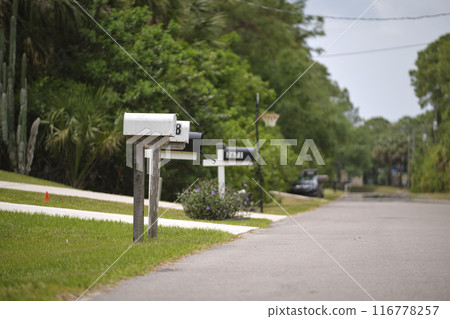 Typical american outdoors mail box on suburban street side Typical american outdoors mail box on suburban street side 116778257