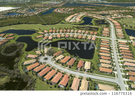 Surrounded by hurricane Ian rainfall flood waters homes in Florida residential area. Aftermath of natural disaster 116778316