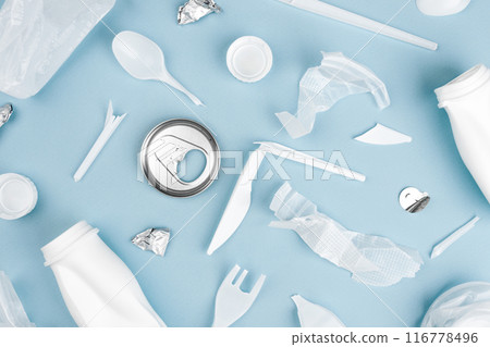 Various recyclable garbage on a blue background Various recyclable garbage on a blue background 116778496