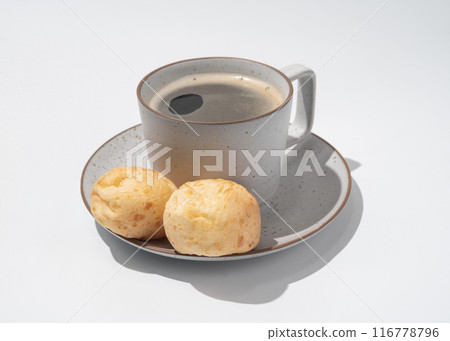 Cup of coffee with Brazilian cheese breads on the white background Cup of coffee with Brazilian cheese breads on the white background 116778796