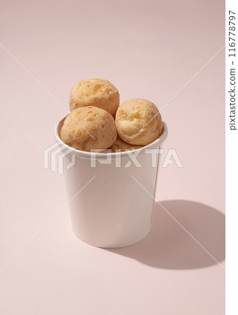 Brazilian cheese breads in paper bucket 116778797