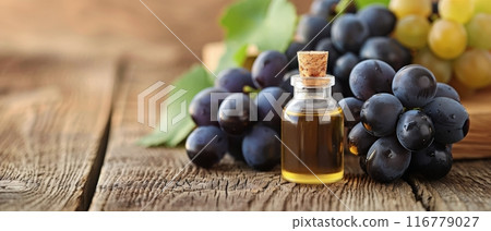 Grape Seed Oil and Grapes on Wooden Table Grape Seed Oil and Grapes on Wooden Table 116779027