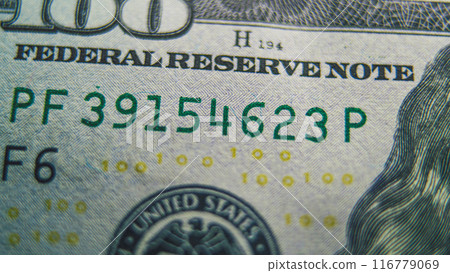 Process of examining authenticity of of hundred dollar bill 116779069