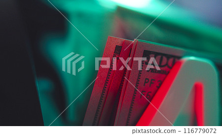 Close up of bill counter machine counting hundred dollar bills 116779072