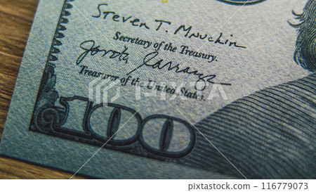 Process of examining authenticity of of hundred dollar bill Process of examining authenticity of of hundred dollar bill 116779073