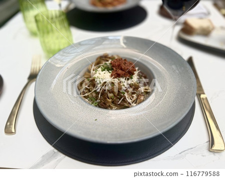 Spaghetti Carbonara with parmesan cheese on a restaurant table at Malta, Mdina 116779588