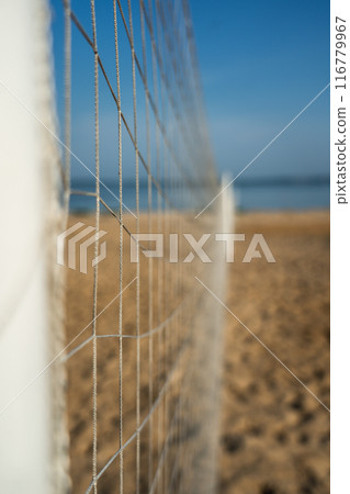 Volleyball net on the lake beach. Volleyball court on the beach Volleyball net on the lake beach. Volleyball court on the beach 116779967