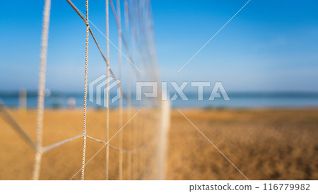 Volleyball net near. Volleyball court on the beach overlooking the sea Volleyball net near. Volleyball court on the beach overlooking the sea 116779982
