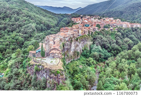 Panoramic drone picture of the historic town of Castellfollit de la Roca in Catalonia in the morning light Panoramic drone picture of the historic town of Castellfollit de la Roca in Catalonia in the morning light 116780073