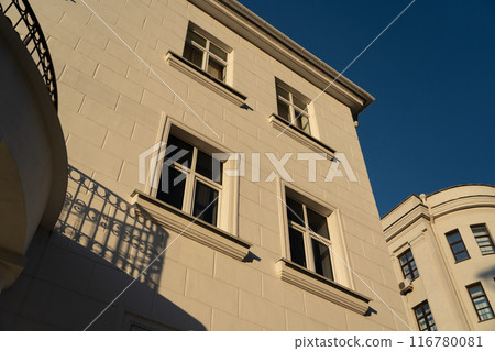 An old, vintage brick building with a view of the evening, clear sky 116780081