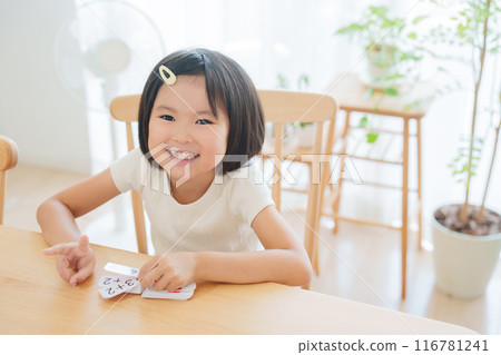 Elementary school student studying math for summer vacation homework Elementary school student studying math for summer vacation homework 116781241